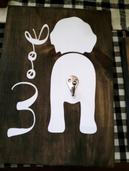 wooden woof sign with leash hook